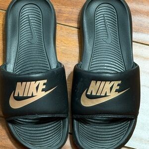 Nike Black Slides with Metallic Bronze Logo